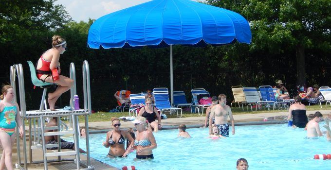 Lifeguard Speaking with Adults in the Pool