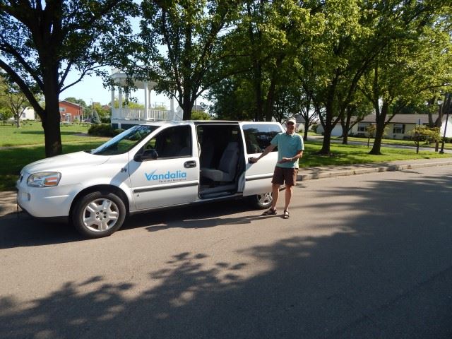 Man Opening a Van Door